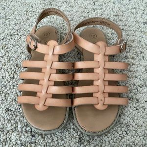 Used. Cat and tan sandals. Normal kids wear and tear.